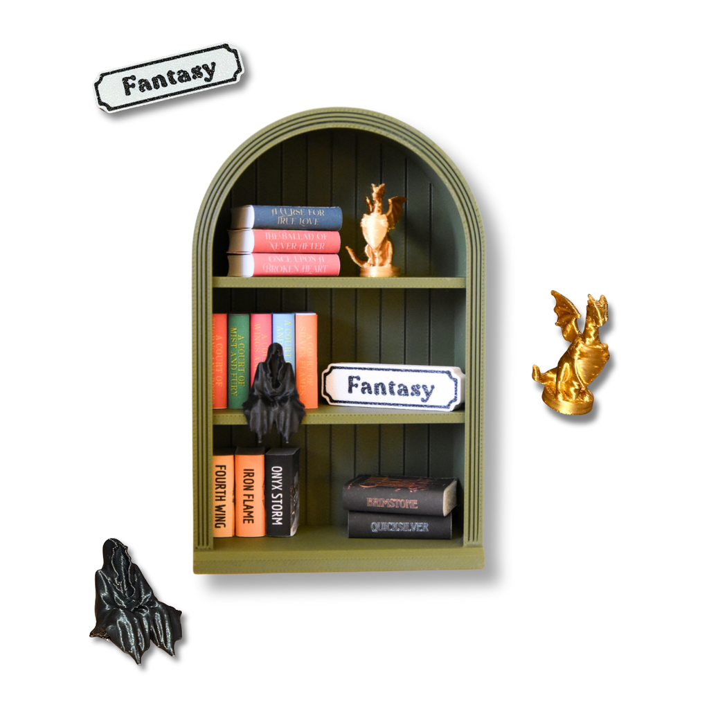 Decorative shelf with books and figurines labeled 'Fantasy' on a white background