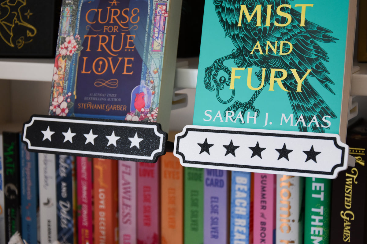 Two books displayed side by side. Each has a decorative label on the bottom with 5 stars in black and white.
